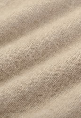 Close-up of beige fabric texture.