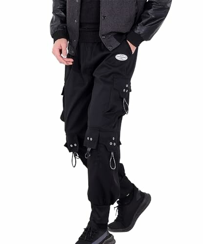 Person wearing black cargo pants with chains