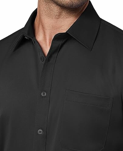 Man wearing black dress shirt with pocket.