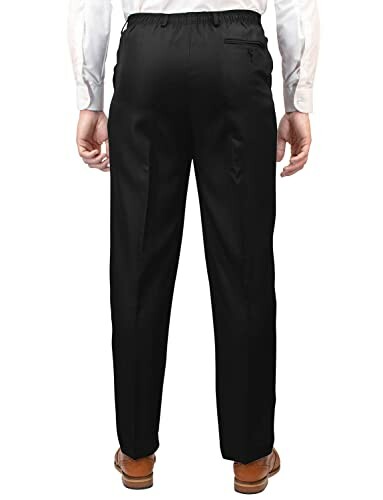 Back view of man wearing black formal pants