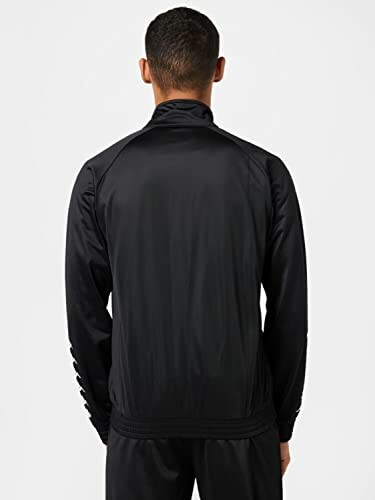Back view of a person wearing a black jacket.