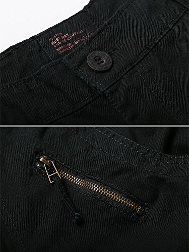 Close-up of black pants with button and zipper details