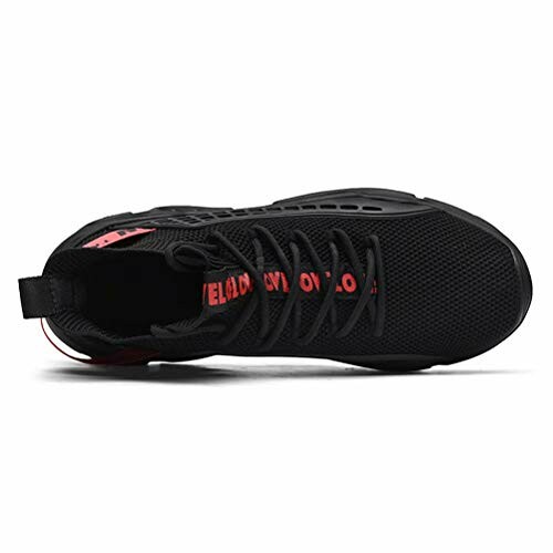 Top view of a black sneaker with red accents.