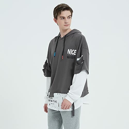Person wearing a layered hoodie with text 'NICE' on it.