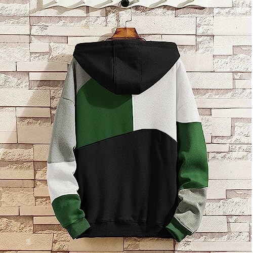 Back view of a color-block hoodie with green, black, and gray sections.