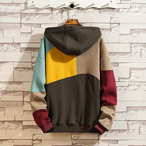 Color block hoodie with brown, yellow, blue, red sections hanging on wall