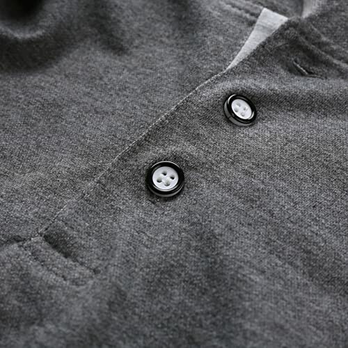 Close-up of gray fabric with two buttons