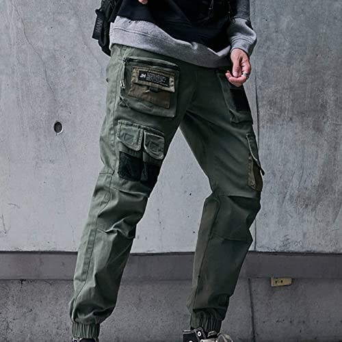 Person wearing green cargo pants with multiple pockets