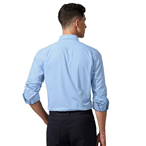 Man in blue shirt viewed from the back