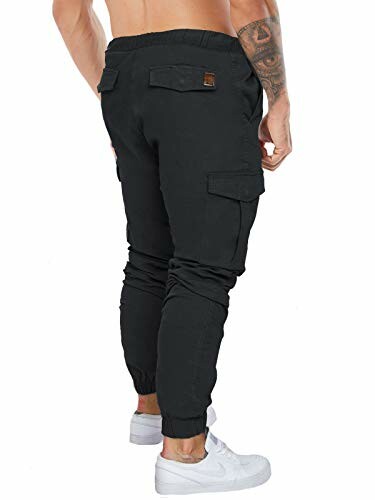 Man wearing black cargo jogger pants and white sneakers